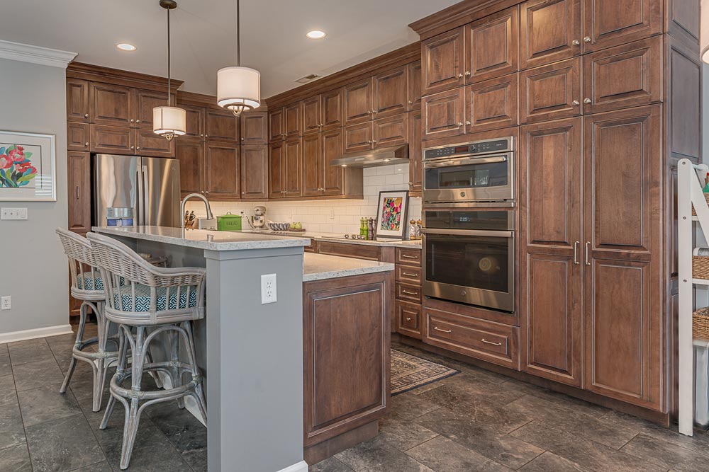 greg papenfus tuttle kitchen design with wood cabinetry and gray island