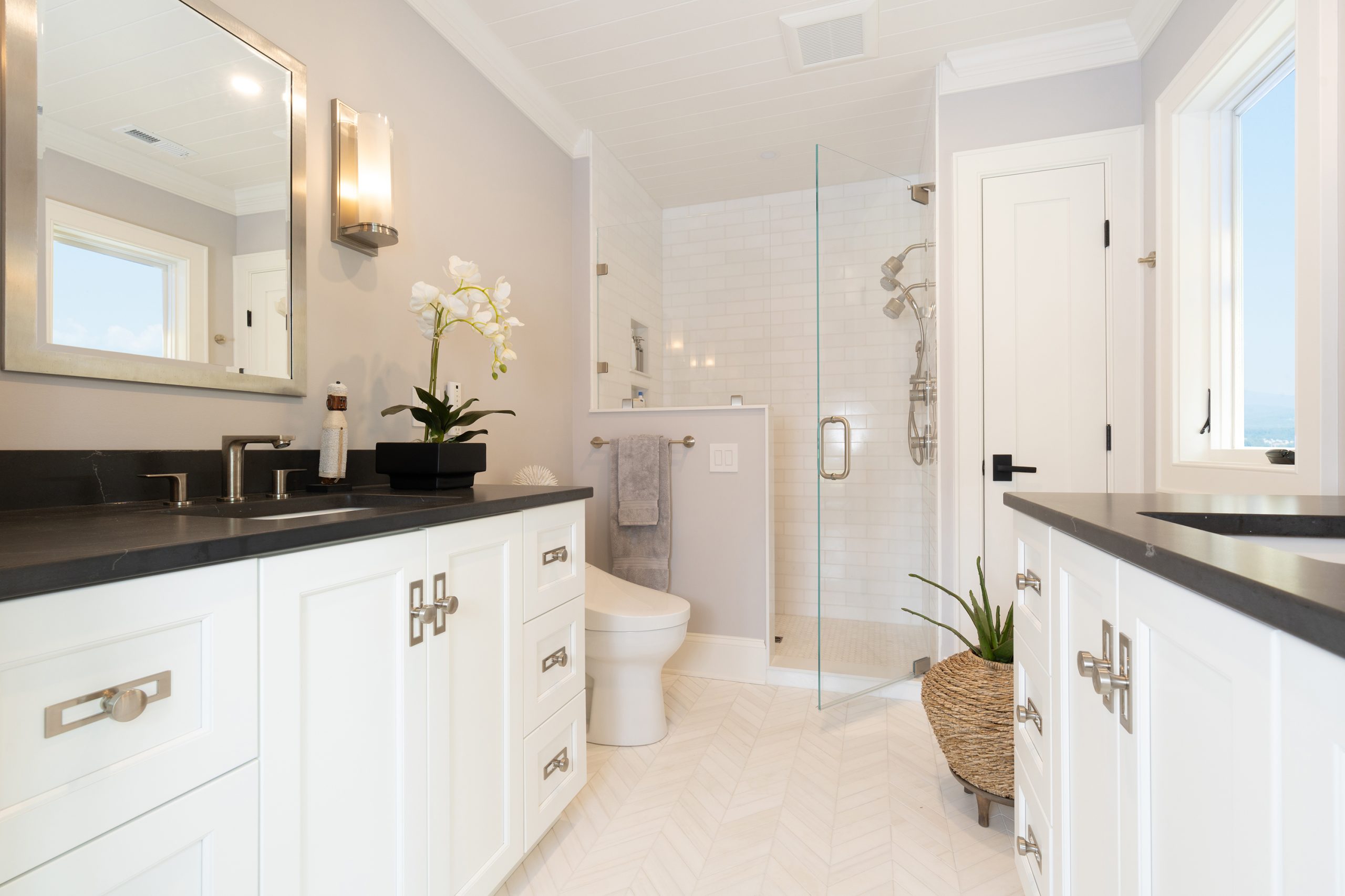 bathroom design studio in roanoke virginia features bathroom cabinet design with dual vanity and modern tub at Ideal Cabinets
