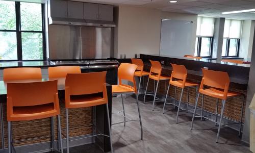 ideal cabinets commercial cabinetry design bar with orange stools