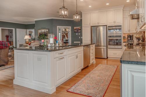 greg papenfus vaughan kitchen design white kitchen island base cabinets and granite countertop