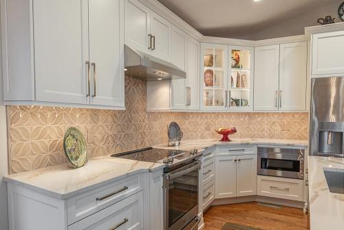 lara lee strickler kemp kitchen design white cabinetry and stainless steel appliances