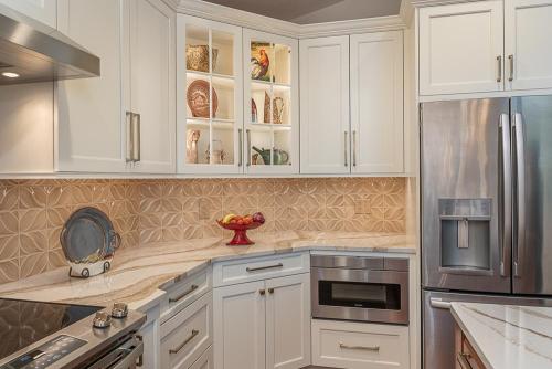 lara lee strickler kemp kitchen design white cabinetry and stainless steel appliances