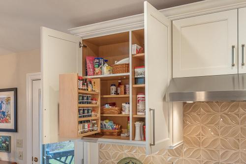 lara lee strickler kemp kitchen design white cabinetry with pull-out shelves