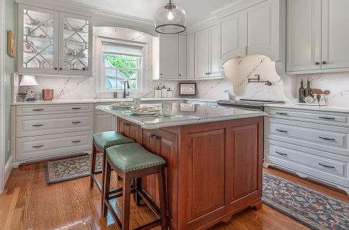ideal cabinets becky ross kitchen design sea green with white cabinets and wood cabinet island