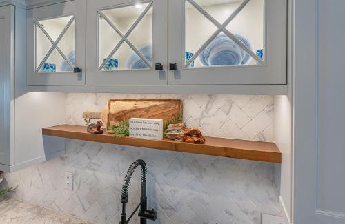 ideal cabinets lara lee strickler kitchen design hinton sink overhead cabinets glass doors
