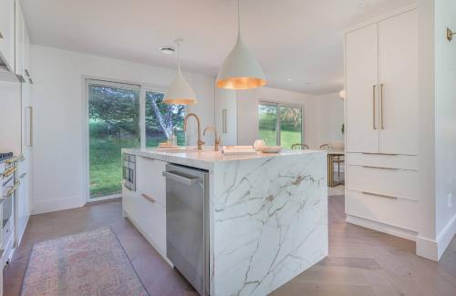 ideal cabinets adriana stevers design keeton kitchen white gold marble island