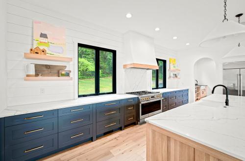 ideal cabinets victoria bombardieri kitchen design blue base cabinets with white countertop and floating wood shelves
